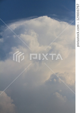 A developed cumulonimbus cloud approaches the tropopause and is about to become an anvil. A developed cumulonimbus cloud approaches the tropopause and is about to become an anvil. 129808767