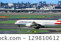 American Airlines plane taxiing down the runway 129810612