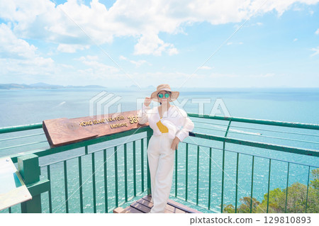 Woman tourist traveling in Krabi, Thailand. happy traveller enjoy and sightseeing view at koh Hong island viewpoint. summer trip, destination, Southeast Asia Travel, vacation and holiday concept 129810893