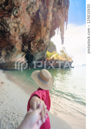 couple tourist travel and sightseeing in Krabi, Thailand. happy traveller enjoy on beach at Phra nang Cave Beach near Railay Beach. Honeymoon, tropical destination, Travel and summer vacation concept 129810930