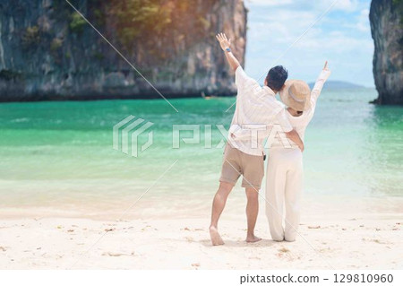 Couple tourist traveling and sightseeing in Krabi, Thailand. happy traveller enjoy on beach at koh Hong island. Honeymoon trip, destination, Southeast Asia Travel, summer vacation and holiday concept Couple tourist traveling and sightseeing in Krabi, Thailand. happy traveller enjoy on beach at koh Hong island. Honeymoon trip, destination, Southeast Asia Travel, summer vacation and holiday concept 129810960