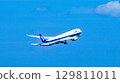 An ANA plane takes off into the blue sky 129811011