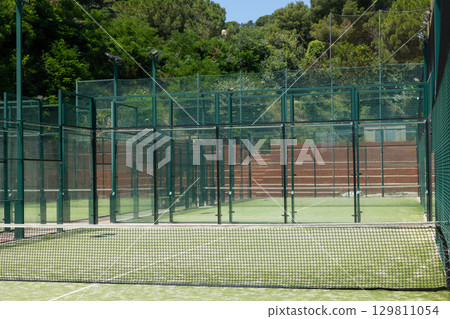 Close-up of net on tennis court, stadion, arena. Sport lifestyle background. Concept of professional game sports Close-up of net on tennis court, stadion, arena. Sport lifestyle background. Concept of professional game sports 129811054