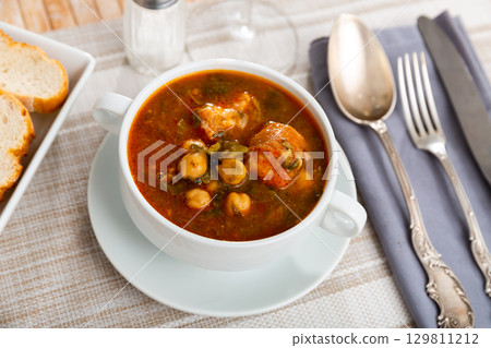 Traditional Spanish soup with beans, chickpeas and meat Traditional Spanish soup with beans, chickpeas and meat 129811212