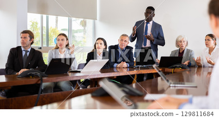 Mature african male speaker holding corporate meeting 129811684