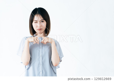 A woman doing a cross pose A woman doing a cross pose 129812669