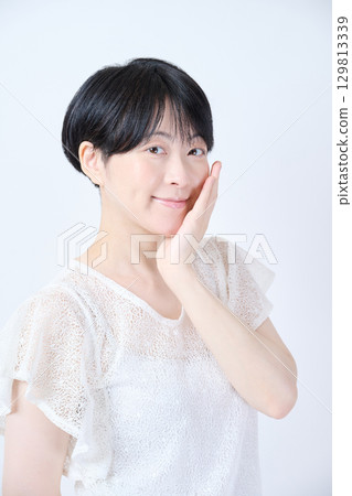 Beauty of a middle-aged woman with short hair Beauty of a middle-aged woman with short hair 129813339