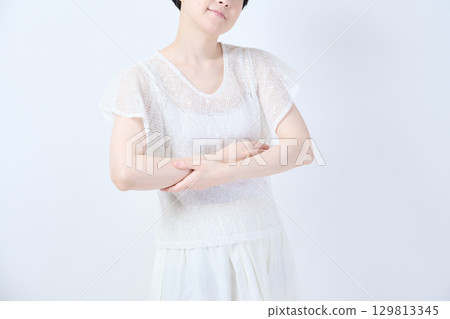 Image of a woman's upper arm Image of a woman's upper arm 129813345