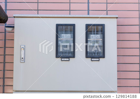 An electrical panel installed on the exterior wall of an apartment building An electrical panel installed on the exterior wall of an apartment building 129814188