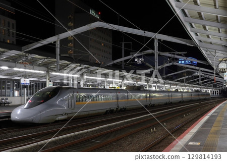 Sanyo Shinkansen 700 series Hikari Railstar train arriving at Fukuyama Station at night 129814193