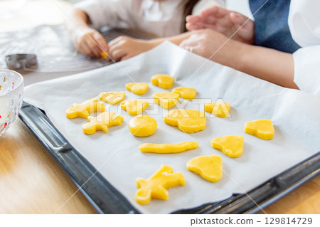 Parents and children making cookies together Parents and children making cookies together 129814729
