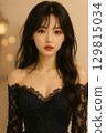 A woman in a black dress 129815034