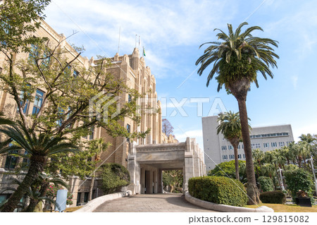 Miyazaki Prefectural Office Main Building and palm trees decorating the tropical landscape 129815082