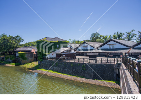 Rice storage warehouses remaining along the river 129815428