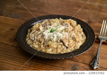 Mushroom risotto with ajillo oil Mushroom risotto with ajillo oil 129815562