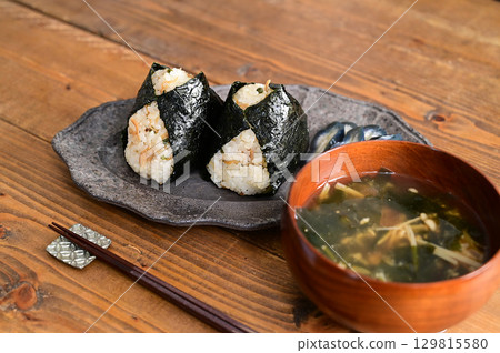 Dried sardines and Japanese pepper rice balls and miso soup 129815580