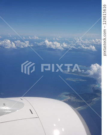 The horizon and summer sky from the airplane window The horizon and summer sky from the airplane window 129815616