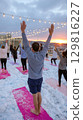 Snowy Yoga Session at Sunset 129816227