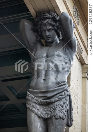 Close-up of the granite Atlantean statue at the New Hermitage in Saint Petersburg, Russia 129816287