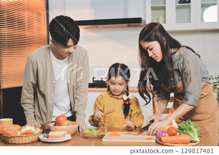 Family spends their free time together Family spends their free time together 129817481