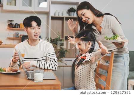 Family spends their free time together Family spends their free time together 129817551