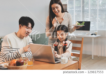 Family spends their free time together Family spends their free time together 129817553