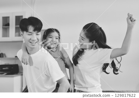 Family spends their free time together Family spends their free time together 129817622