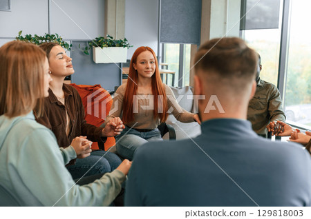 Therapy meeting in the circle together. Group of people 129818003