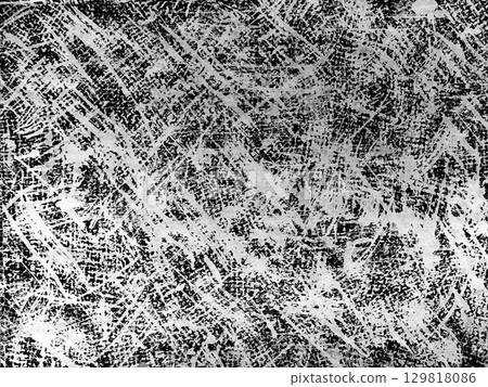 Textured black and white pattern created by overlapping lines and strokes on a surface Textured black and white pattern created by overlapping lines and strokes on a surface 129818086