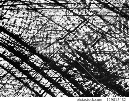 Abstract black and white pattern created by intersecting lines and textures on a textured surface Abstract black and white pattern created by intersecting lines and textures on a textured surface 129818482