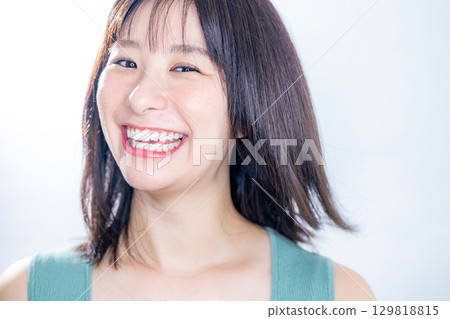 woman blowing her hair 129818815