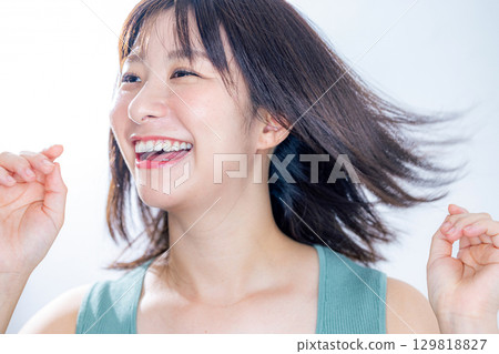 woman blowing her hair 129818827