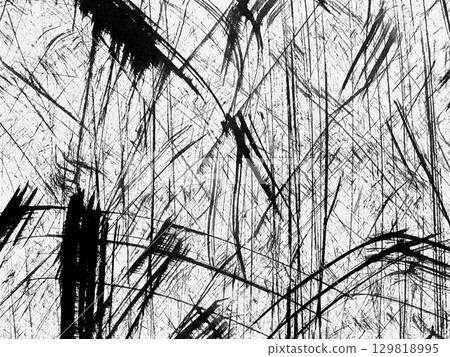 Abstract black and white texture with dynamic lines created by scratches on a surface 129818995