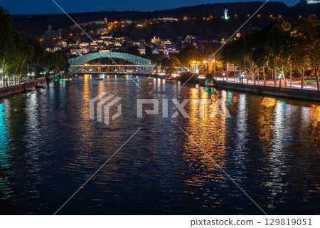 Night view of Mtkvari river waterfront in central Tbilisi, the capital of Georgia 129819051