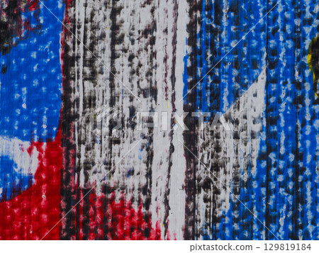 Colorful abstract painting featuring vibrant red, blue, and black patterns on a textured surface 129819184