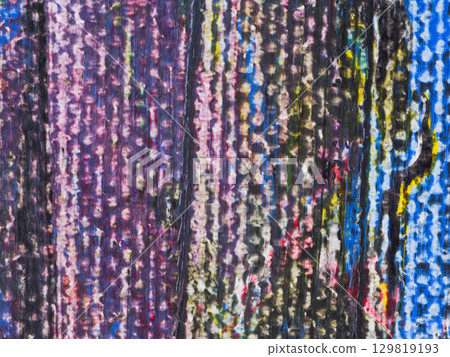 Abstract artwork featuring vibrant colors and textures created through layered paint techniques on a canvas 129819193