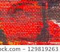 Bold abstract art with vibrant red and textured layers, showcasing dynamic patterns and colors 129819263