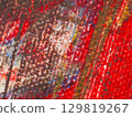 Abstract artwork with vibrant colors and textured details created in an artistic studio environment 129819267