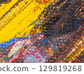 Vibrant abstract painting displaying bold colors and textures on canvas at an art gallery 129819268