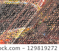 Colorful abstract texture representing artistic brush strokes on a canvas with vibrant hues and intricate patterns 129819272