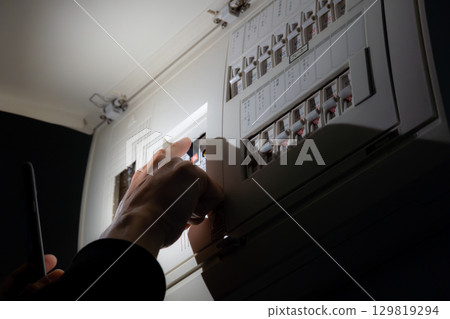 Power outage restored by lighting up with a smartphone light Power outage restored by lighting up with a smartphone light 129819294