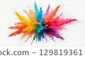 A vivid explosion of colored powder fills the air, creating a striking visual display in a studio. The dynamic colors blend beautifully, forming an abstract piece of art 129819361