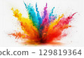 Participants celebrate with a colorful explosion of powdered pigments, filling the air with vibrant hues during a lively outdoor festival in bright sunlight, creating a joyful atmosphere 129819364