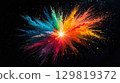 A stunning display of colored powders bursts in a variety of shades, illuminating the night sky. The explosion creates a vibrant and energetic atmosphere, capturing the joy of festivity 129819372