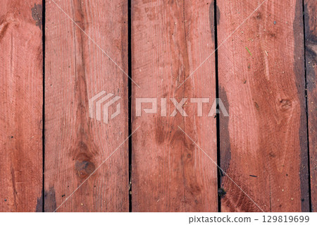 Wooden planks arranged in a rustic pattern offering a warm, natural look for home design Wooden planks arranged in a rustic pattern offering a warm, natural look for home design 129819699
