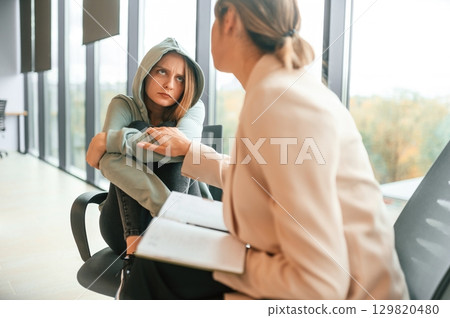 Depressed woman is at an appointment with a psychologist Depressed woman is at an appointment with a psychologist 129820480