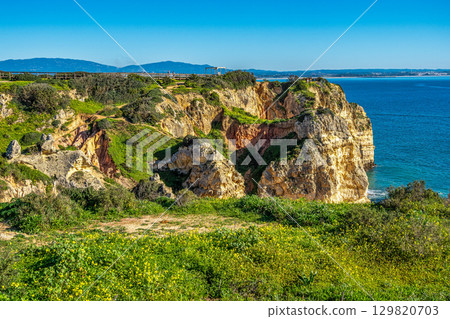 Ponta da Piedade is a unique rock formation with famous grottos in the ocean at Lagos, Algrave, Portugal Ponta da Piedade is a unique rock formation with famous grottos in the ocean at Lagos, Algrave, Portugal 129820703