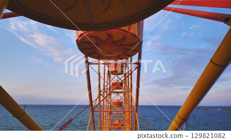 Ferris wheel cabins overlooking the Black Sea in Crimea 129821082