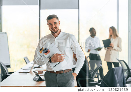 Group of office workers are together indoors Group of office workers are together indoors 129821489