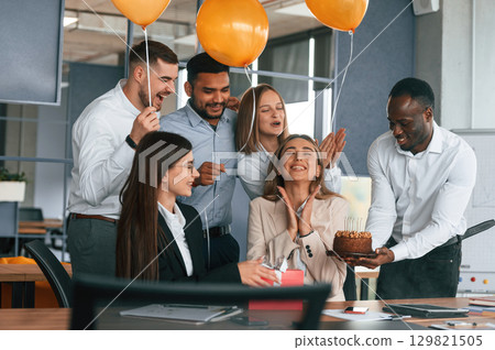 Employee having a birthday in the office, group of workers 129821505